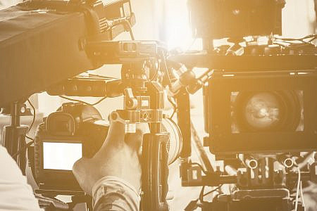 close up of crew with camera and film equipment