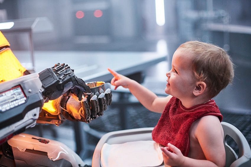 Luke Hawker as “Mother” feeds Summer Lenton as “Toddler” in I Am Mother.