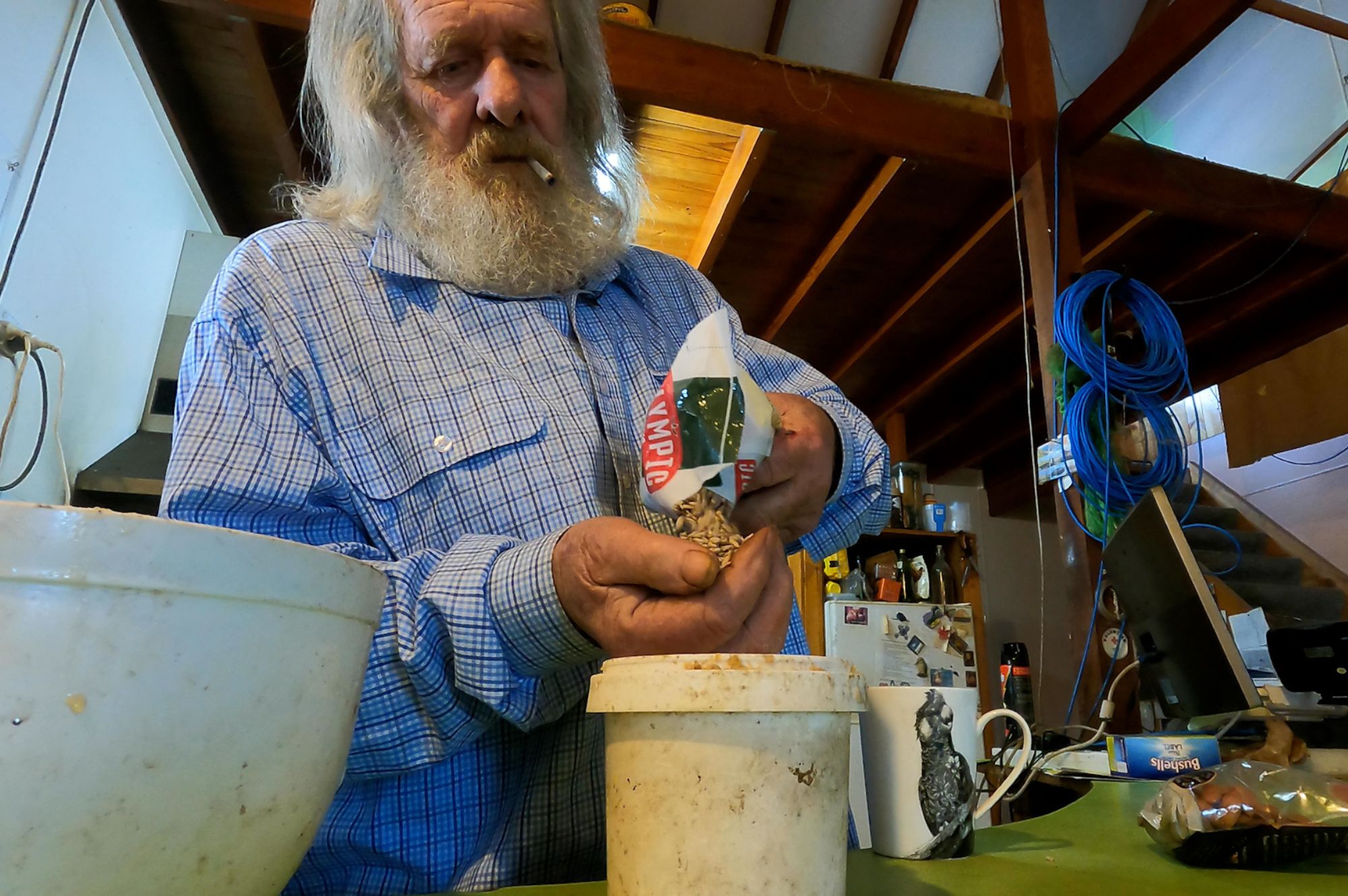 Black cockatoo carer and advocate Wally Erkhof from Moora in WA's Mid West prepares food for some of the birds he is caring for. Photo by Jane Hammond. Black cockatoo carer and advocate Wally Erkhof from Moora in WA's Mid West prepares food for some of the birds he is caring for. Photo by Jane Hammond.